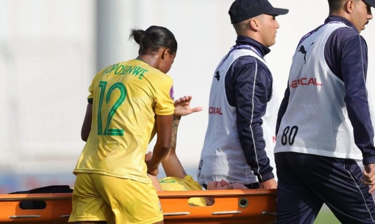 Gabriela Salgado stretched off the field after leg injury.