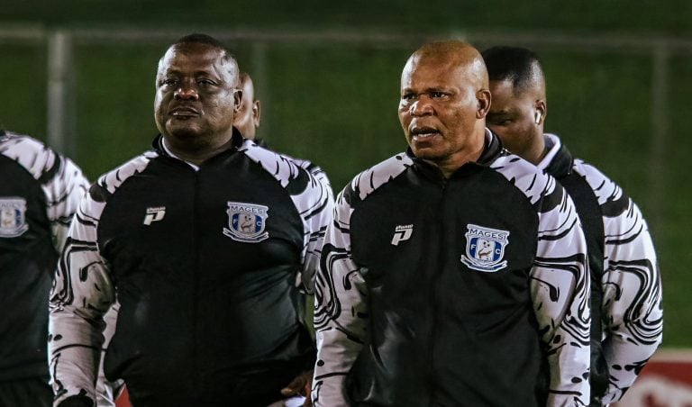 John Maduka and Abram Nteo walking during a pitch inspection