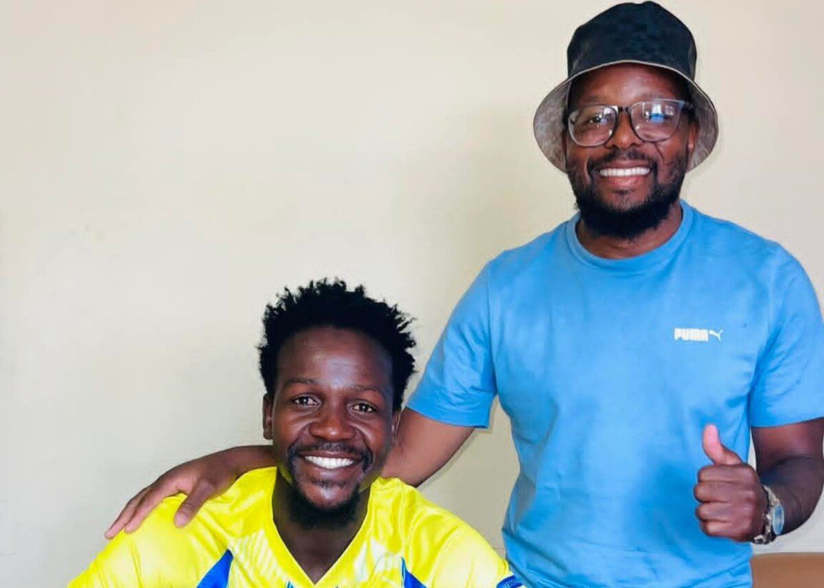 Justice Chabalala with his agent Nimrod Mbhalati after signing for Casric Stars