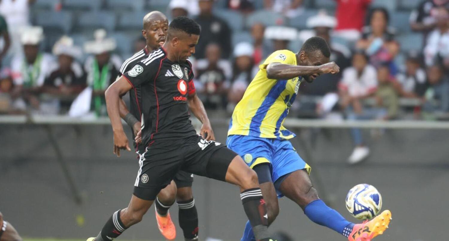 Mpho Chabatsane of Orlando Pirates challenges Casric Stars' Simon Moukete