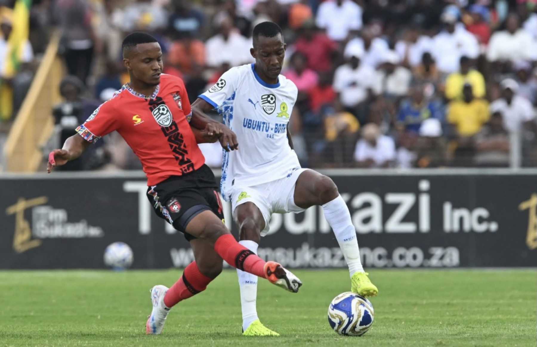 Siphesihle Maduna and Divine Lunga in action during the Nedbank Cup last 16 match at Solomon Mahlangu Stadium