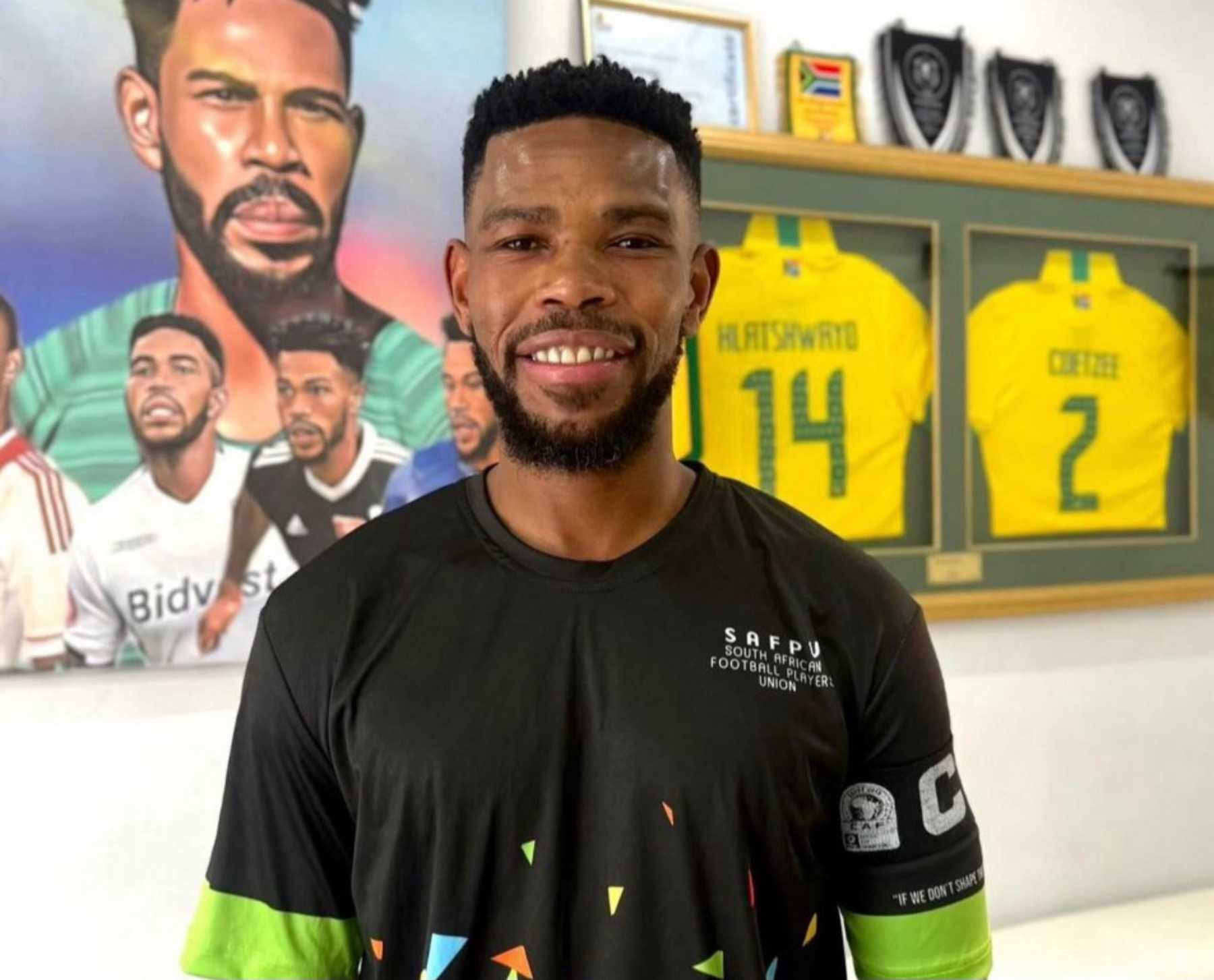 SAFPU president Thulani Hlatshwayo standing next to a wall in his office 