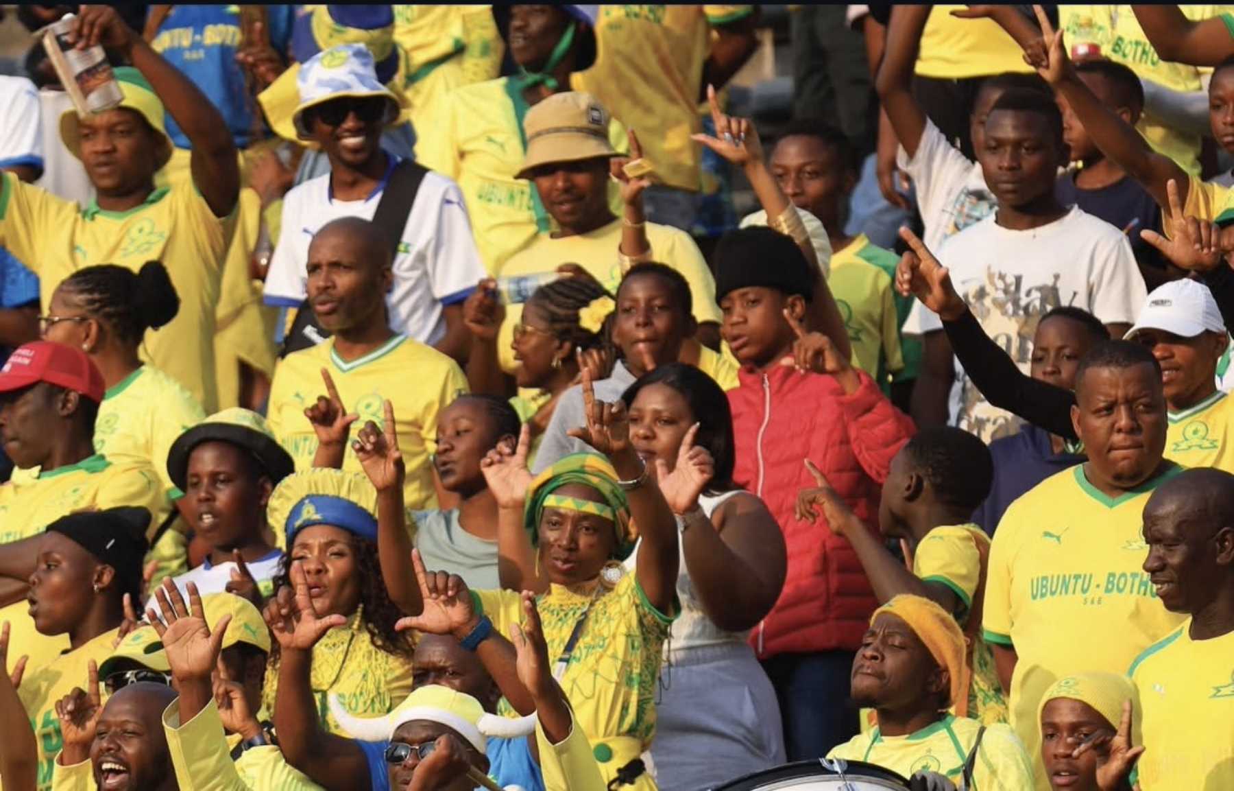 Mamelodi Sundowns fans singing at the stadium.