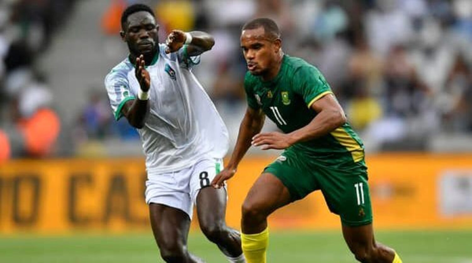 Bafana Bafana striker Iqraam Rayners dribbling pas his South Sudanese marker