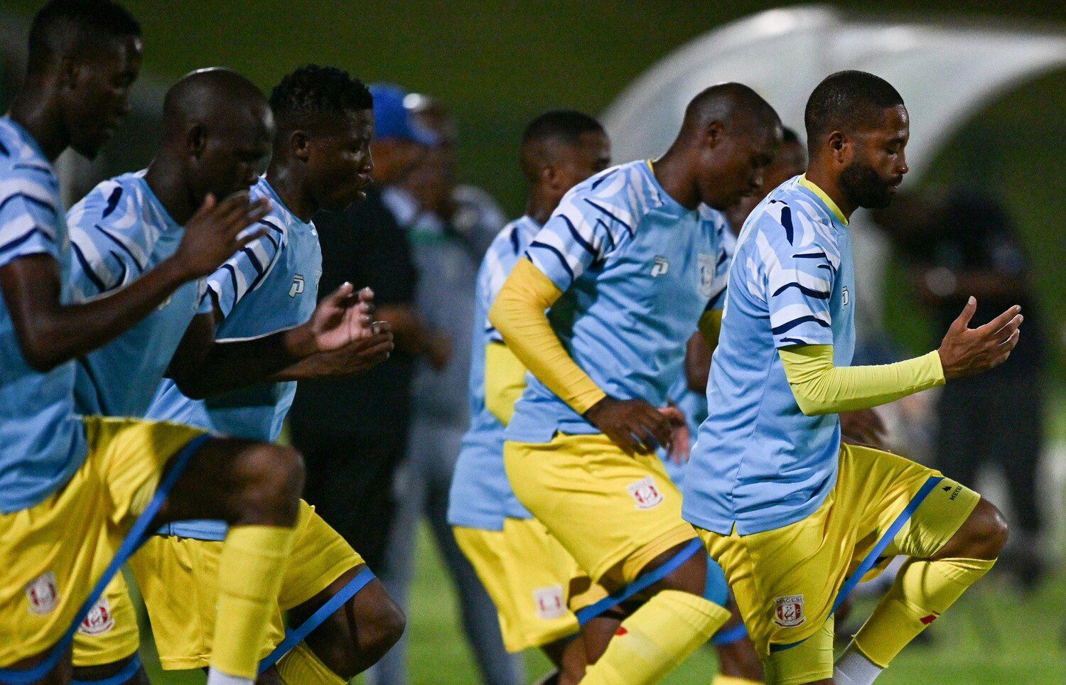 Magesi FC players warming up