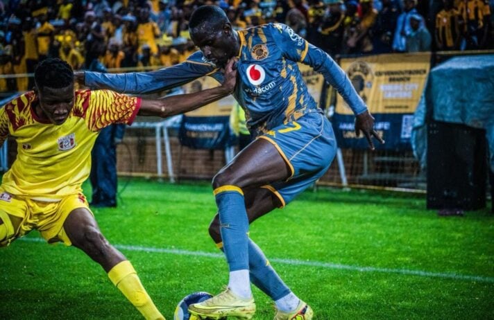 Kaizer Chiefs striker Flavio da Silva trying to beat a Magesi FC defender