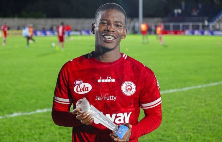Neo Maema holding a man of the match award after a Simba SC match