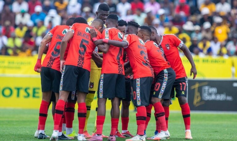 TS Galaxy players circling for pre-match ritual