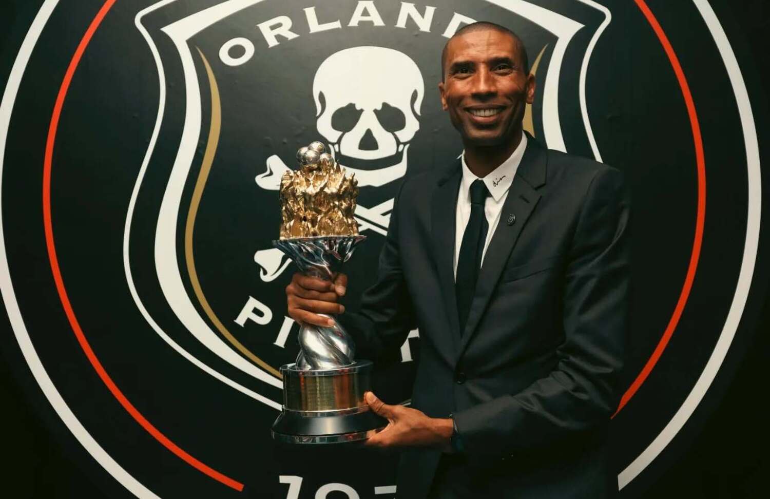 Orlando Pirates coach Abdeslam Ouaddou with the Betway Premiership trophy