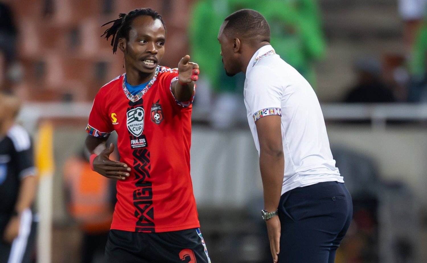 TS Galaxy coach Bernard Parker and Mpho Mvelase discussing tactics