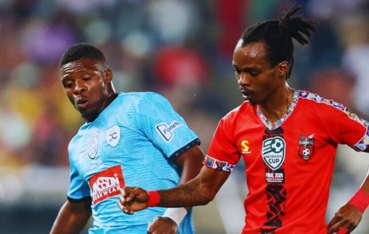 Jean Lwamba of Durban City tussling for posession against TS Galaxy's Mpho Mvelase