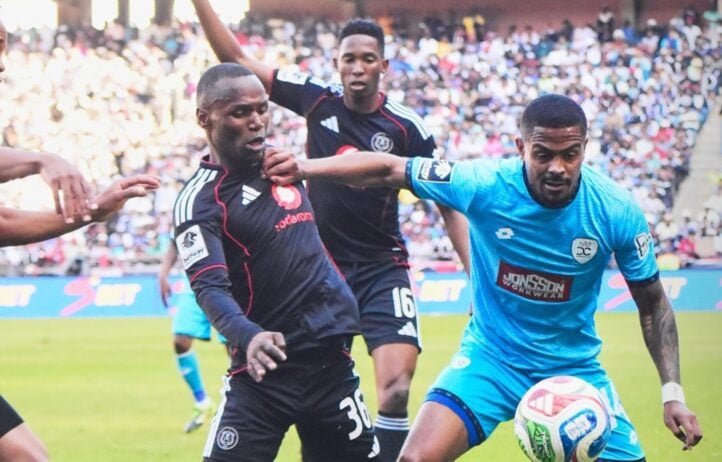 Orlando Pirates wideman Kamogelo Sebelebele challenges Durban City midfielder Joslin Kamatuka