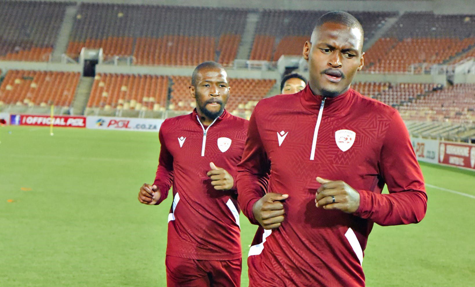 Katlego Mohamme and Kamohelo Mokotjo warm up before a game