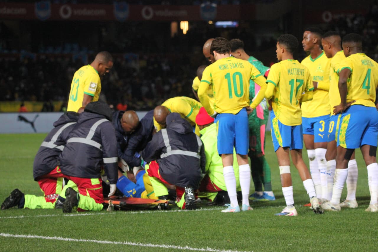Keanu Cupido of Mamelodi Sundowns getting medical assistance after an injury