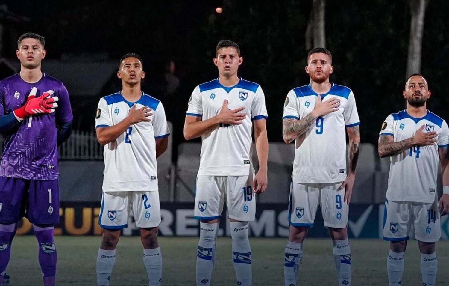 Nicaragua players singing the national anthem before match