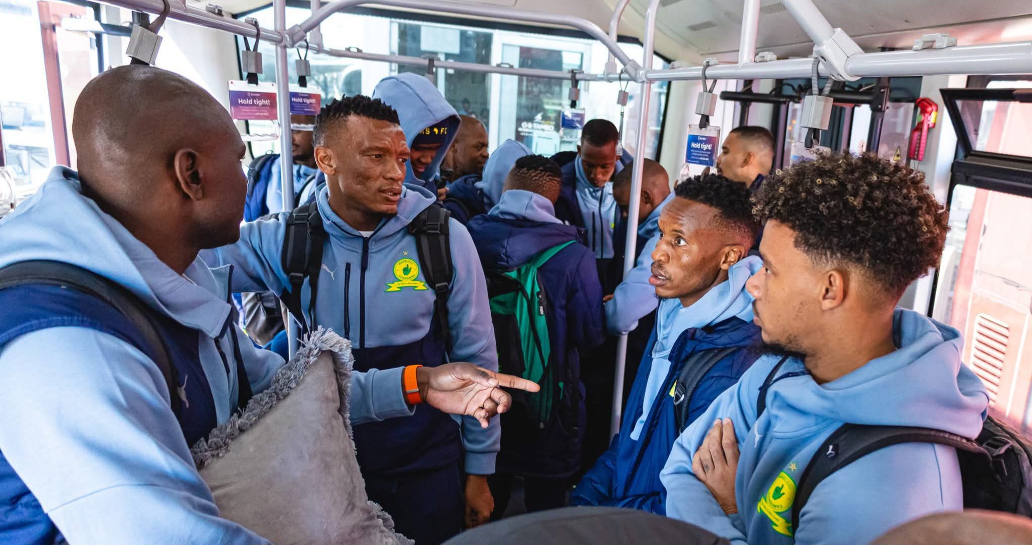 Mamelodi Sundowns players inside a Bus at the Airport.