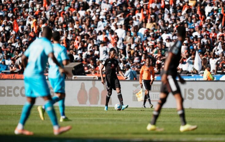 Orlando Pirates midfielder Thalente Mbatha dribbling the ball against Durban City