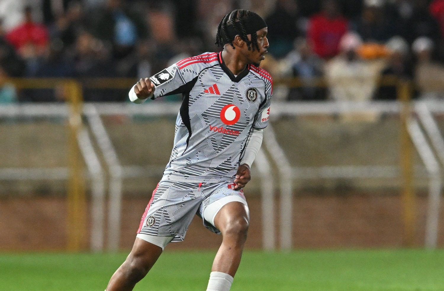Orlando Pirates midfilder Patrick Maswanganyi dribbling the ball