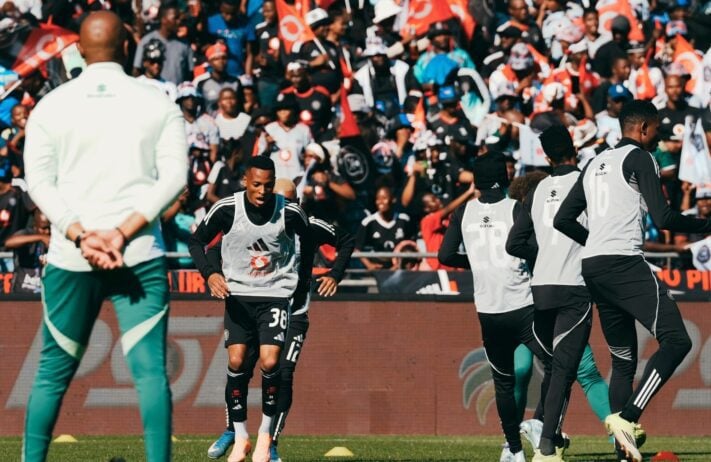 Relebohile Mofokeng and Orlando Pirates players warming up before facing Durban City