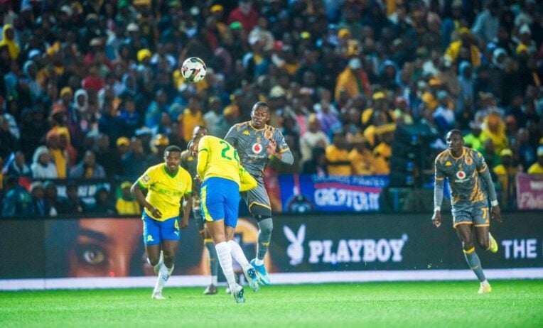 Kaizer Chiefs midfielder Siphesihle Ndlovu challenges Mamelodi Sundowms defender Keanu Cupido
