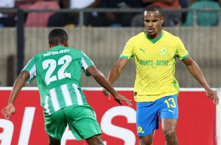 Yandisa Mfolozi of Siwelele FC tries to stop Mamelodi Sundowns Iqraam Rayners