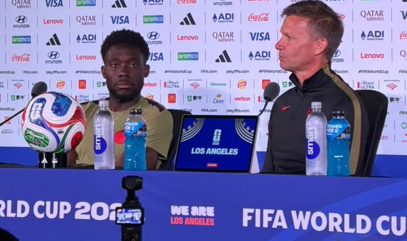 Canada national team head coach Jesse Marsch and player Alphonso Davies speaking at a press conference in Los Angeles regarding the 2026 FIFA World Cup