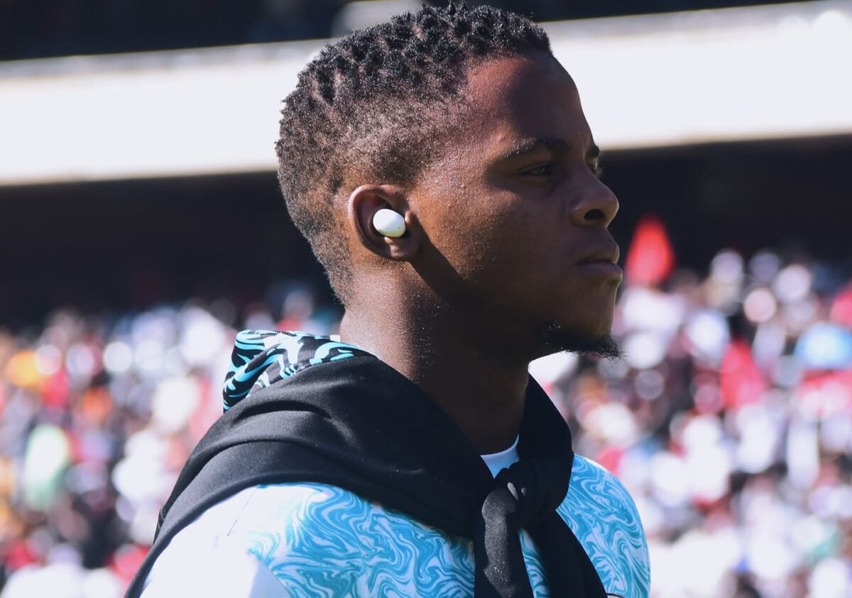 Durban City FC midfielder Luphumlo ‘Kaka’ Sifumba doing a pitch inspection while listening to music