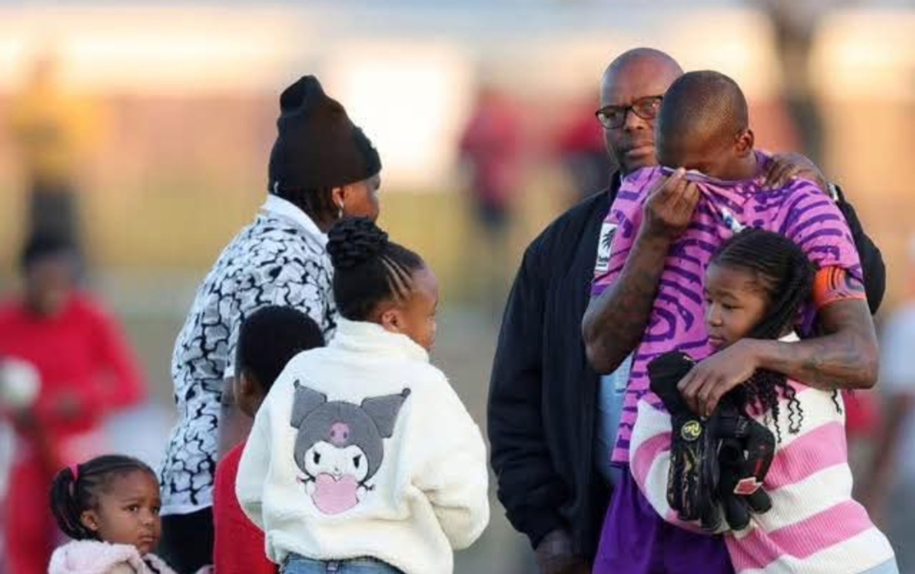 Elvis Chipezeze being consoled by his children after relegation
