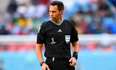 Facundo Tello refereeing a match at the 2022 FIFA World Cup