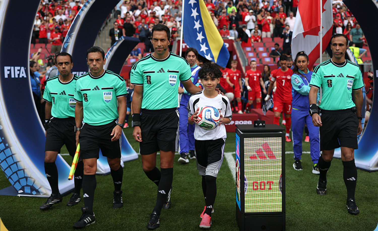 Facundo Tello walks onto the picth with his assistants to handle Canada vs Bosnia and Herzegovinia at the 2026 FIFA World Cup