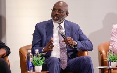 Former Ballon d'Or winner and FIFA World Player of the Year George Weah speaking at an event