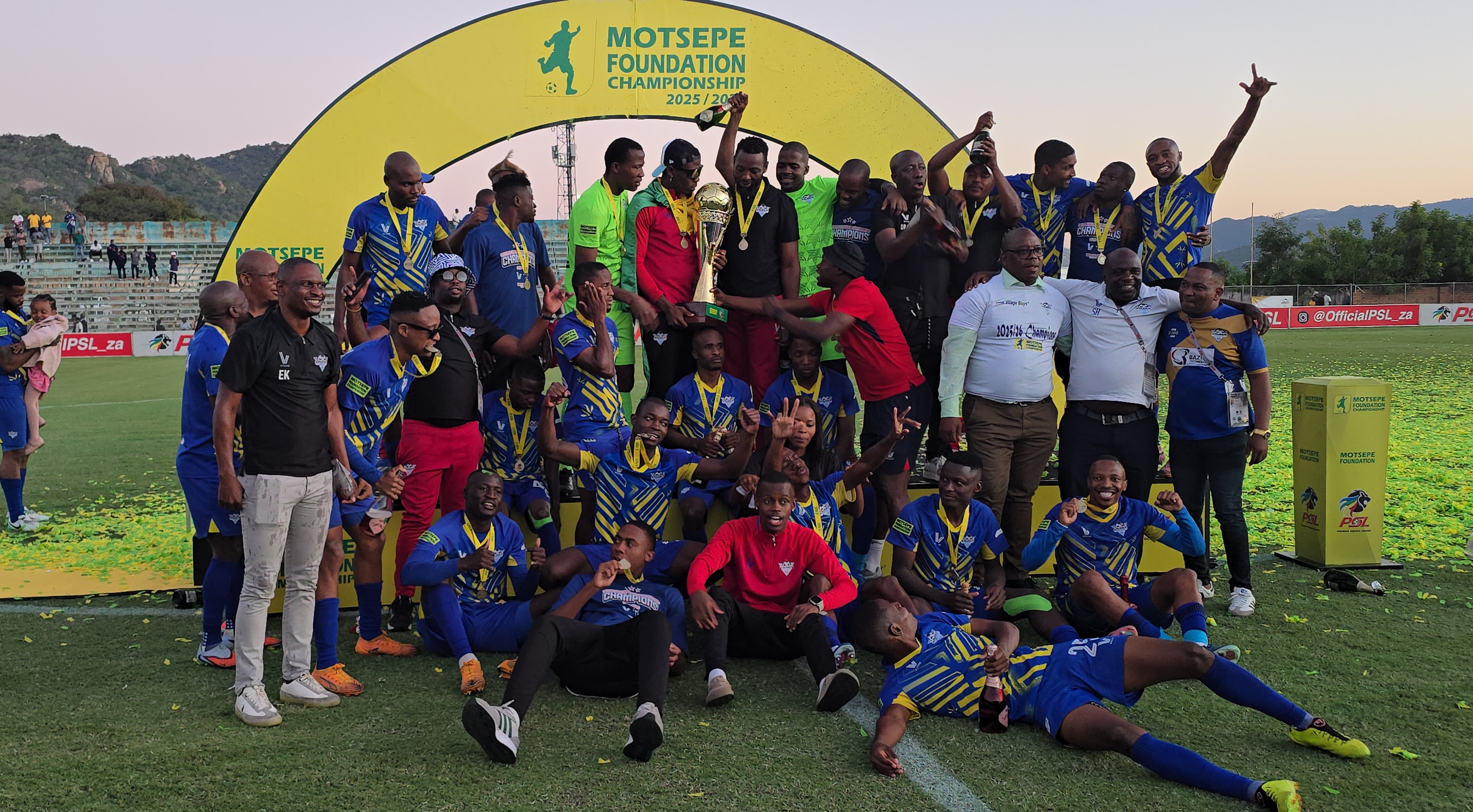 Kruger United lifting the Motsepe Foundation Championship trophy at Kanyamazane Stadium.