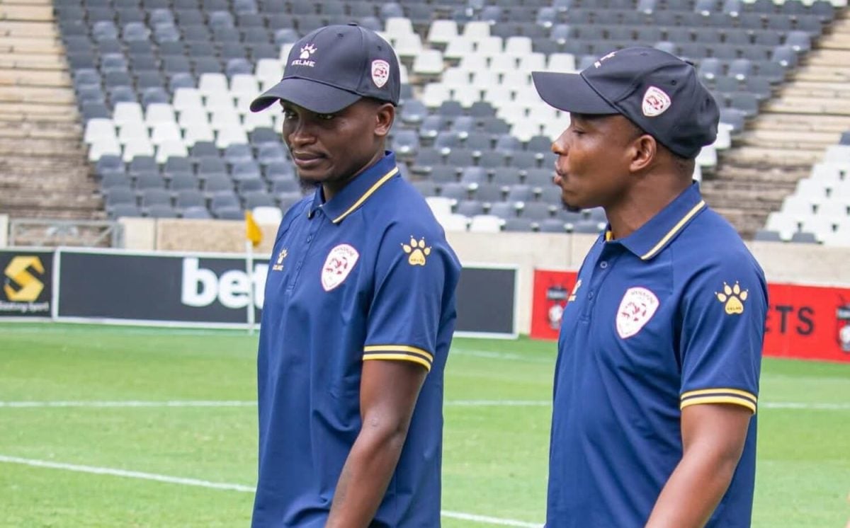 Lesiba Nku with Keletso Makgalwa in Sekhukhune United colours doing pitch inspection
