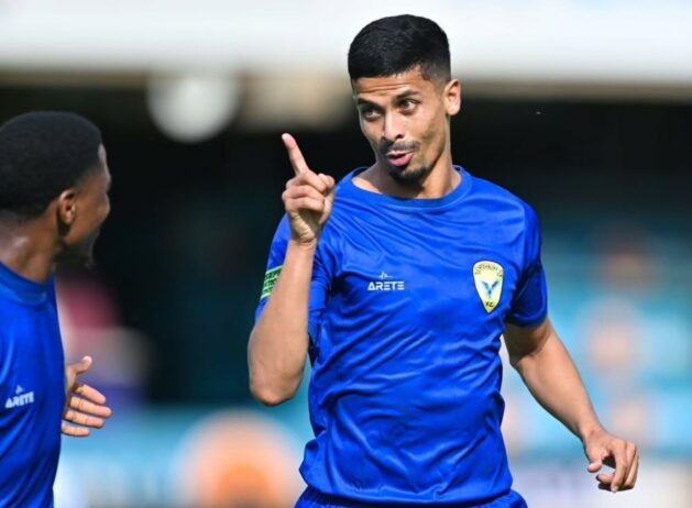 Naeem Amoojee in celebratory mood after scoring for Highbury FC