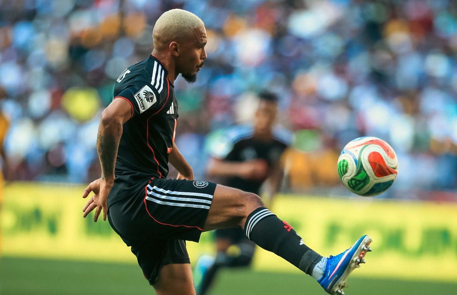 Oswin Appollis controlling the ball while in action for Orlando Pirates