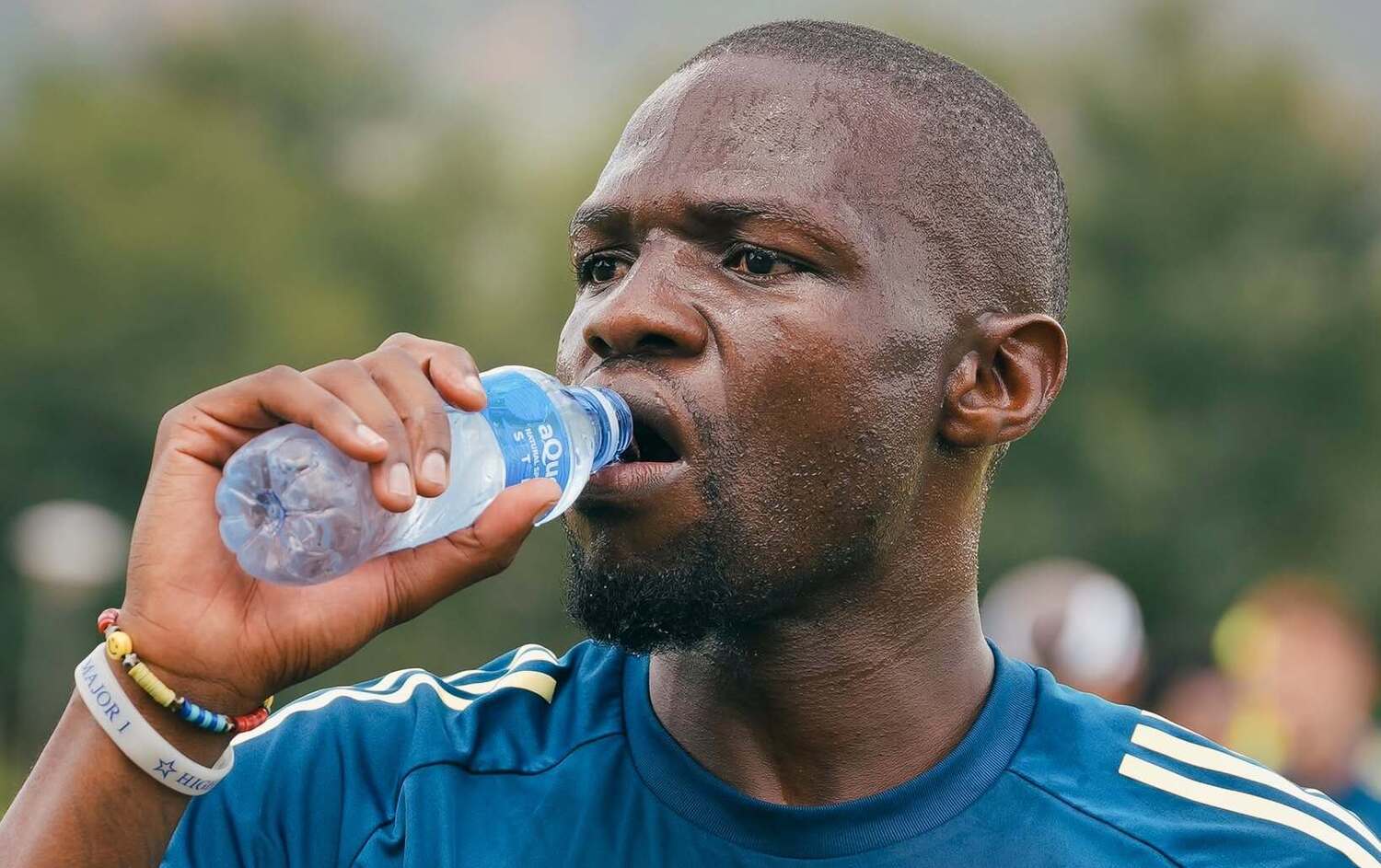 Tshegofatso Mabasa drinking water during an Orlando Pirates training session