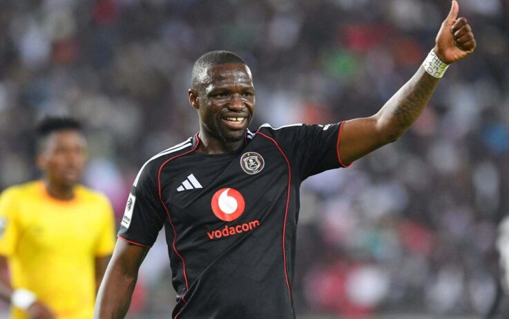 Tshegofatso Mabasa raises up his hand while in action for Orlando Pirates