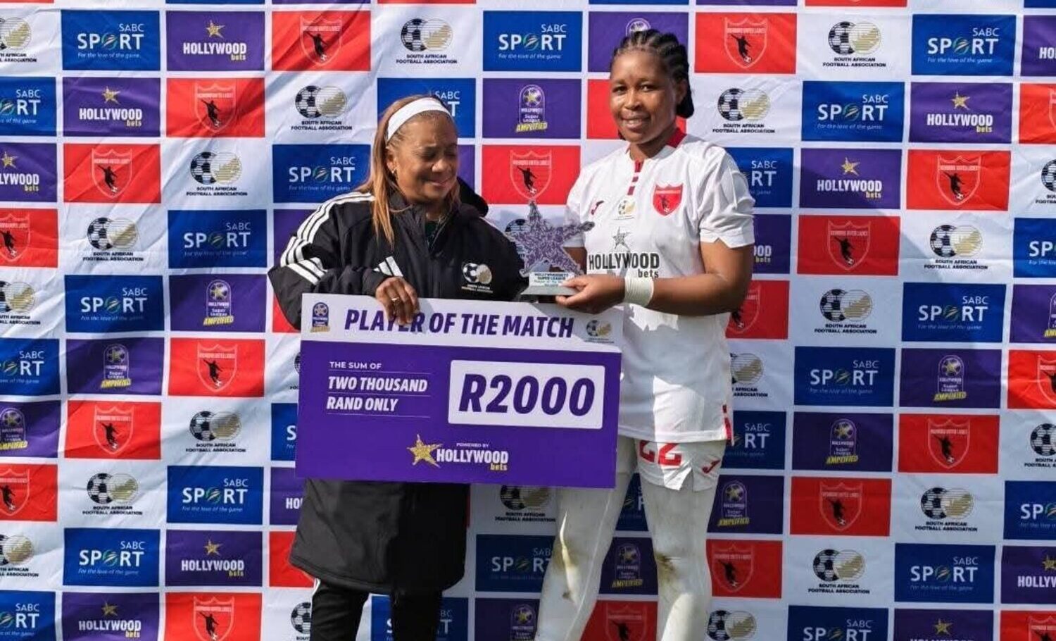 Banyana Banyana head coach Desiree Ellis presents the Player of the Match check to Richmond United Ladiesโ Anna Mphuti