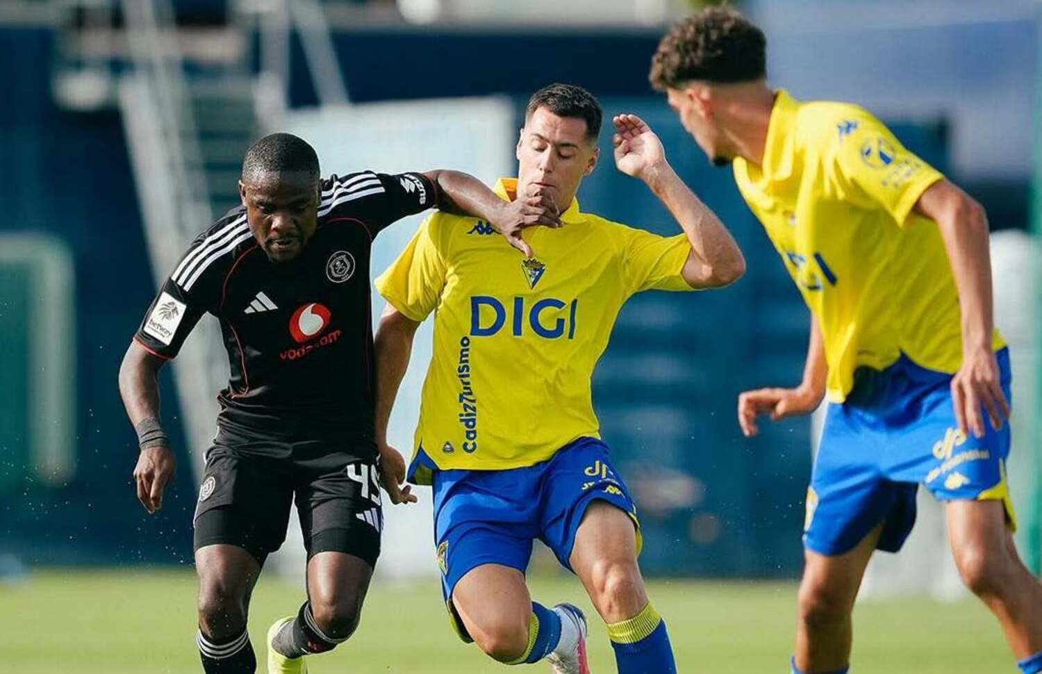Orlando Pirates winger Daniel Msendami being challenged by a Cadiz CF player in a friendly match