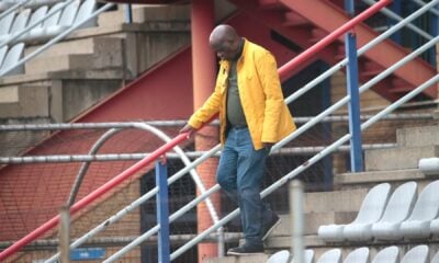 Black Leopards president David Thidiela walking down from the stadium stands.