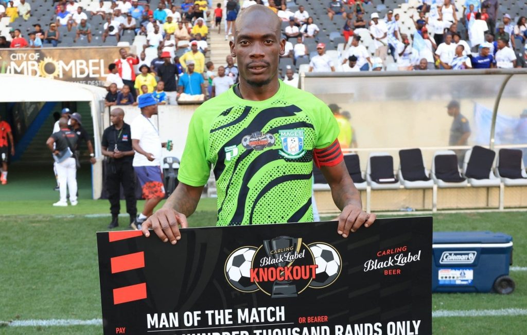 Magesi FC goalkeeper Elvis Chipezeze showing off his Carling Knockout Cup Man of the Match cheque
