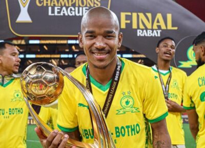 Jayden Adams holding a CAF Champions League trophy with Mamelodi Sundowns