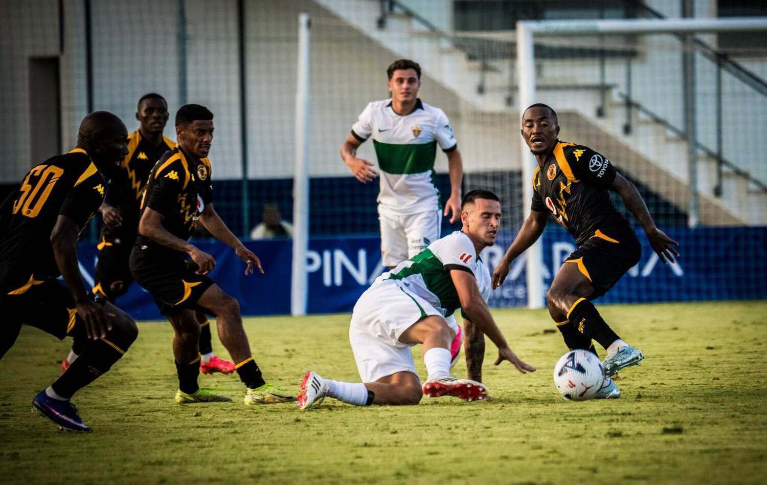 Lebohang Maboe fights for posession while Dillan Solomons and Etiosa Ighodaro supports him during Kaizer Chiefs' friendly match against Elche CF