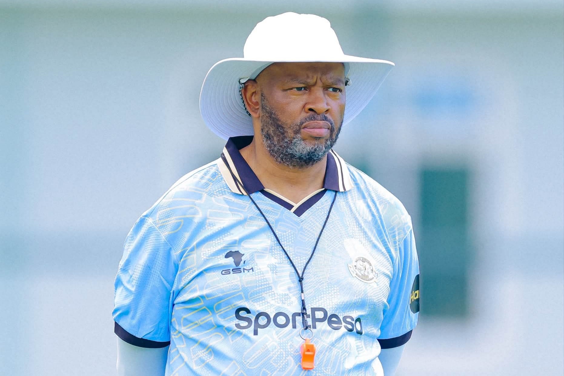 Manqoba Mngqithi looking at his players during a training session with Young Africans