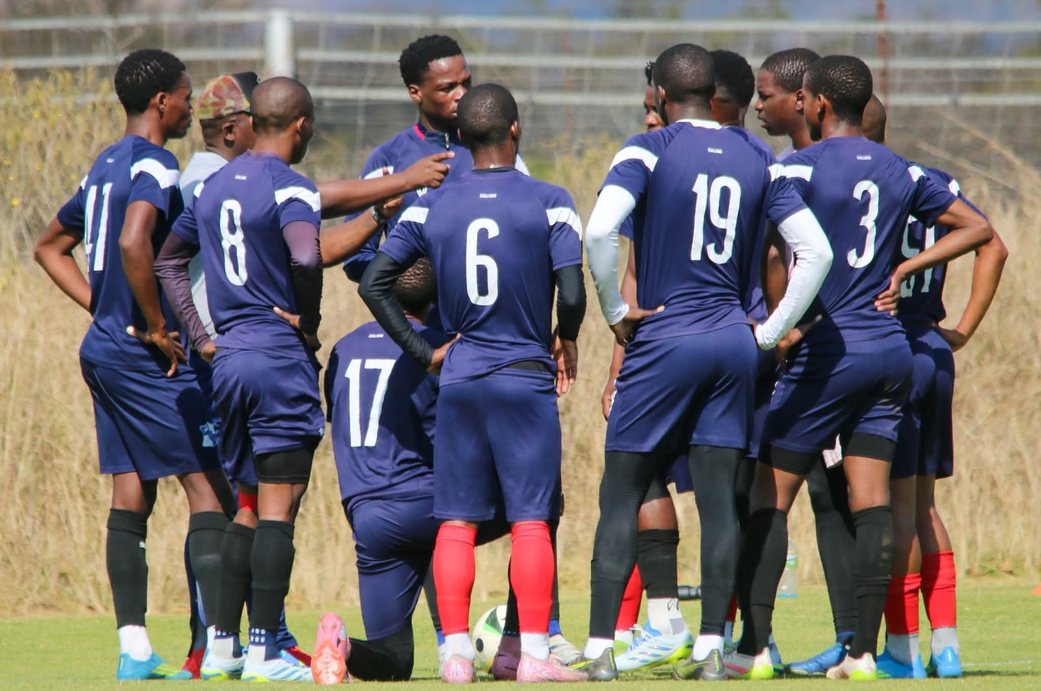 Milford FC players having a conversation during a training session