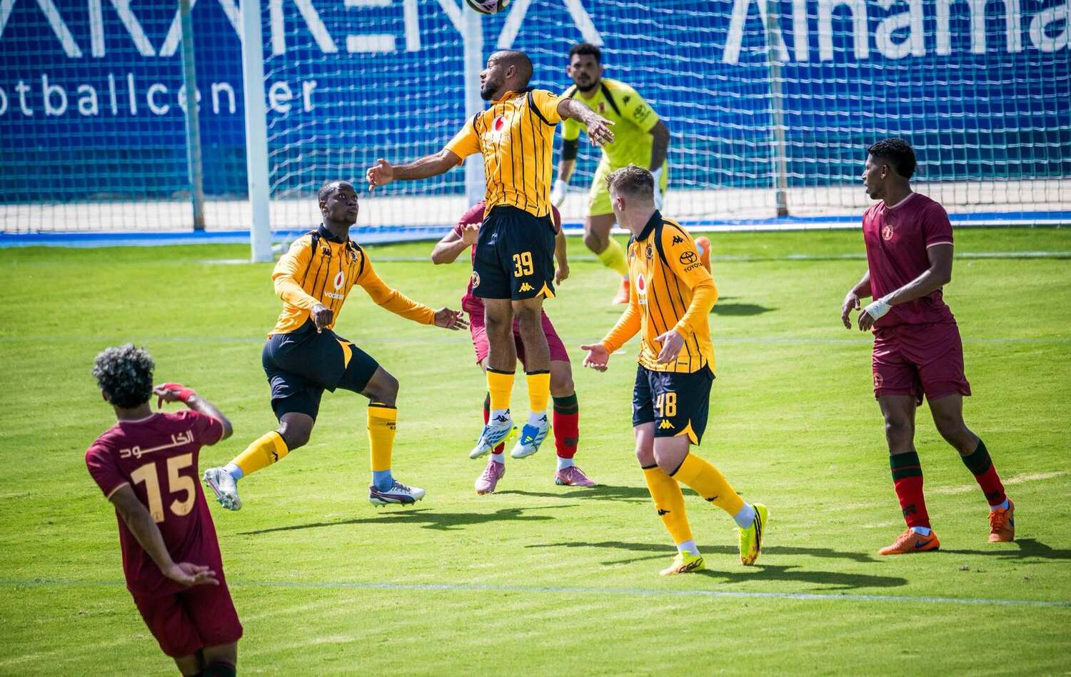 Reeve Frosler heads the ball as Thabo Moloisane and Bradley Cross support him during Kaizer Chiefs' friendly match against Al Kholood