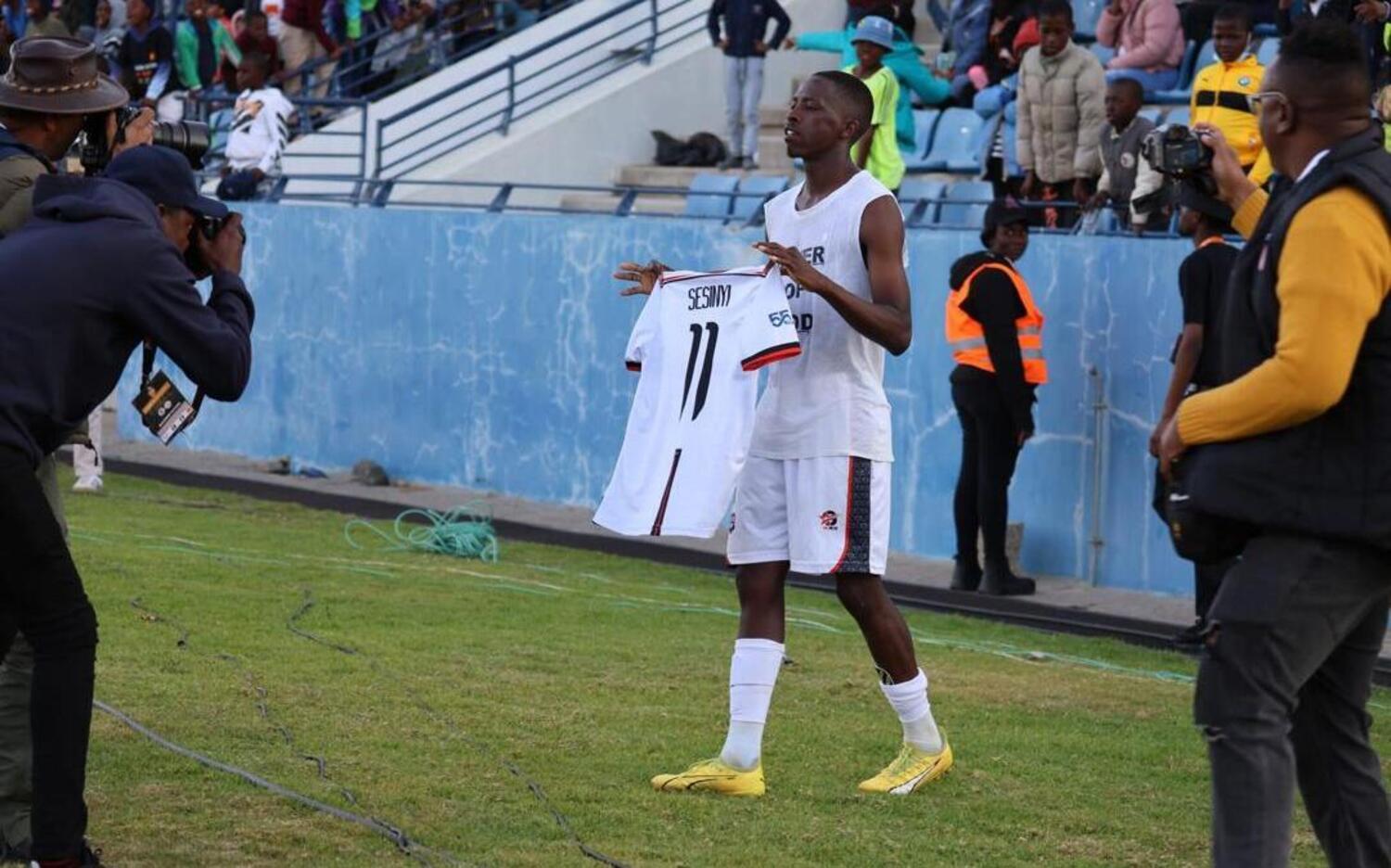 Thabang Sesinyi holding his Jwaneng Galaxy jersey