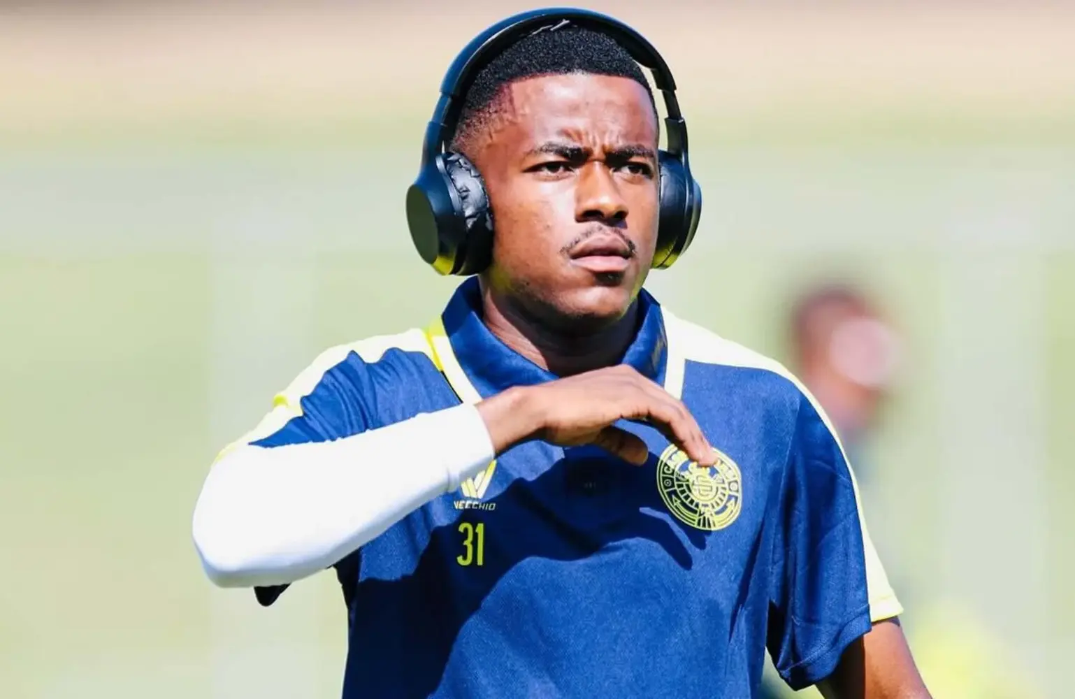 Wandile Mthombeni wearing headphones before a match with Casric Stars.