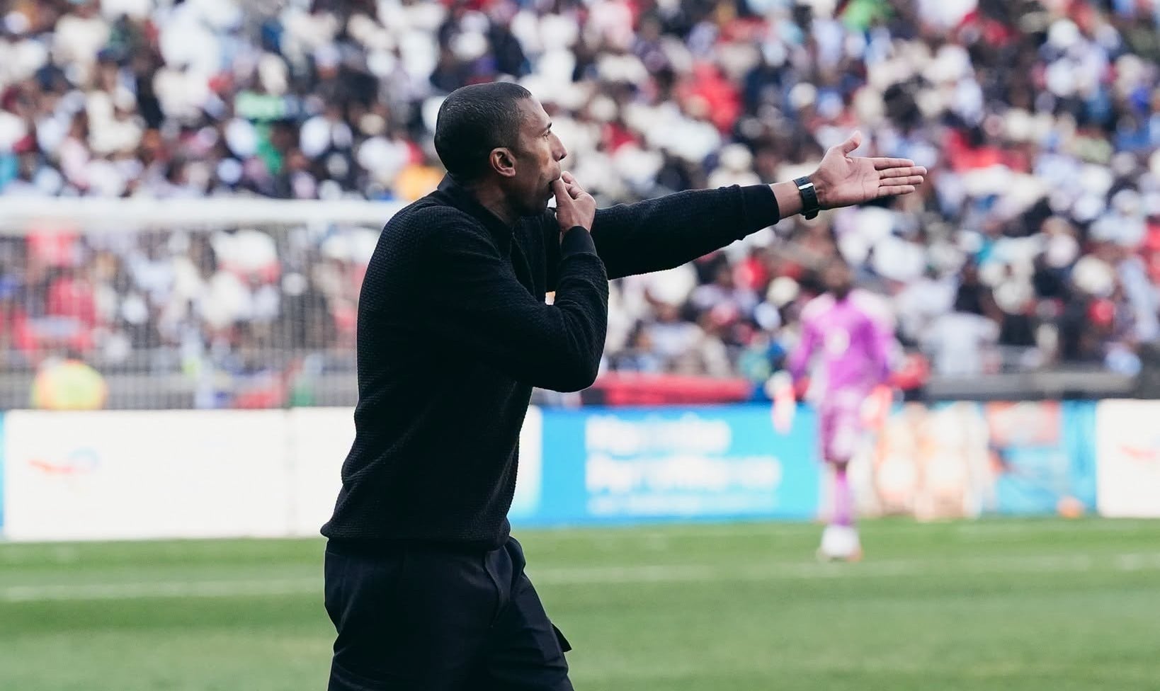 Orlando Pirates coach Abdeslam Ouaddou giving instructions to his players from the bench.