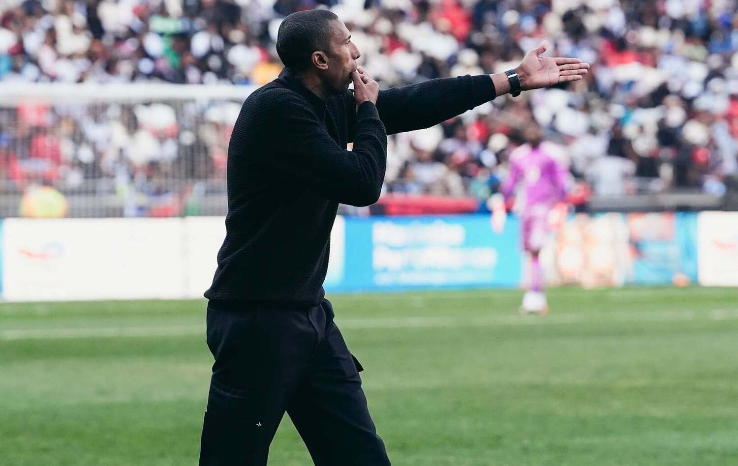 Abdeslam Ouaddou instructing his Orlando Pirates players from the touchline